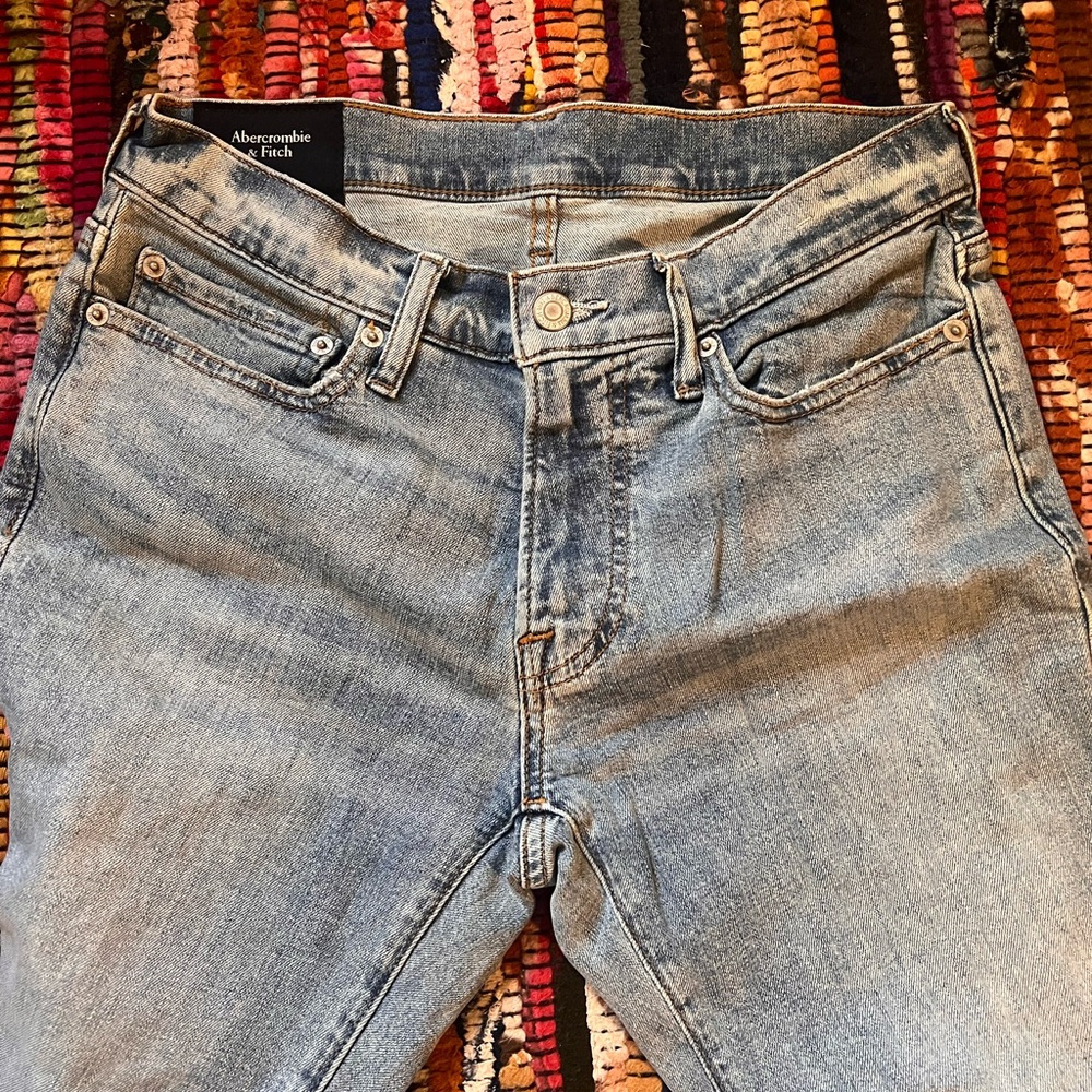Abercrombie and Fitch ripped blue jeans